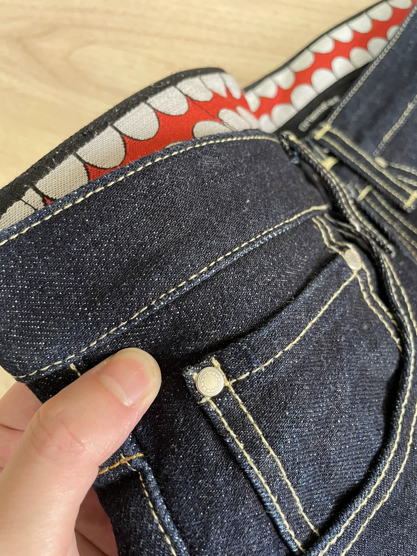 OriginalFake KAWS Selvedge Denim Jeans — label