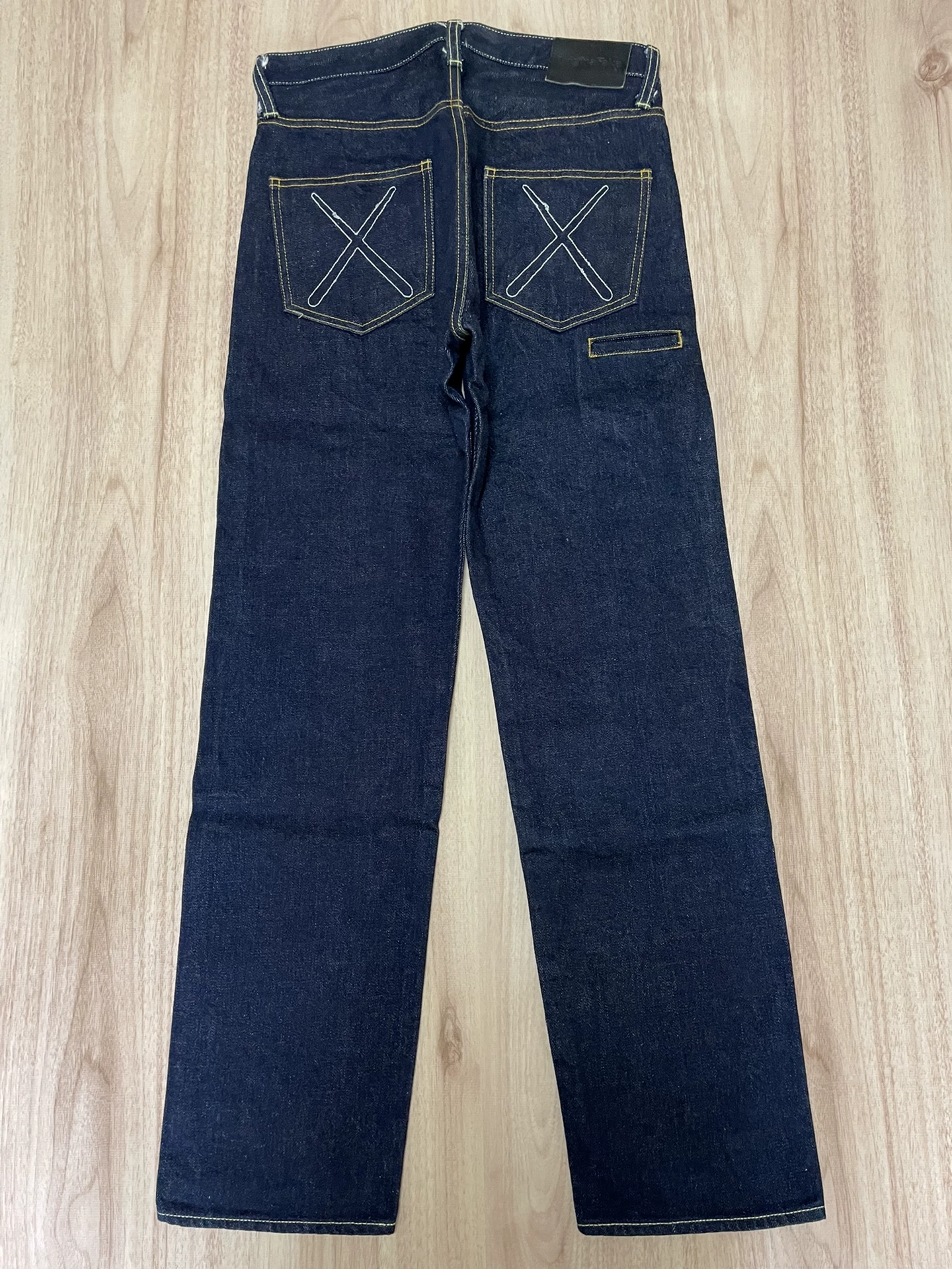 OriginalFake KAWS Selvedge Denim Jeans — front