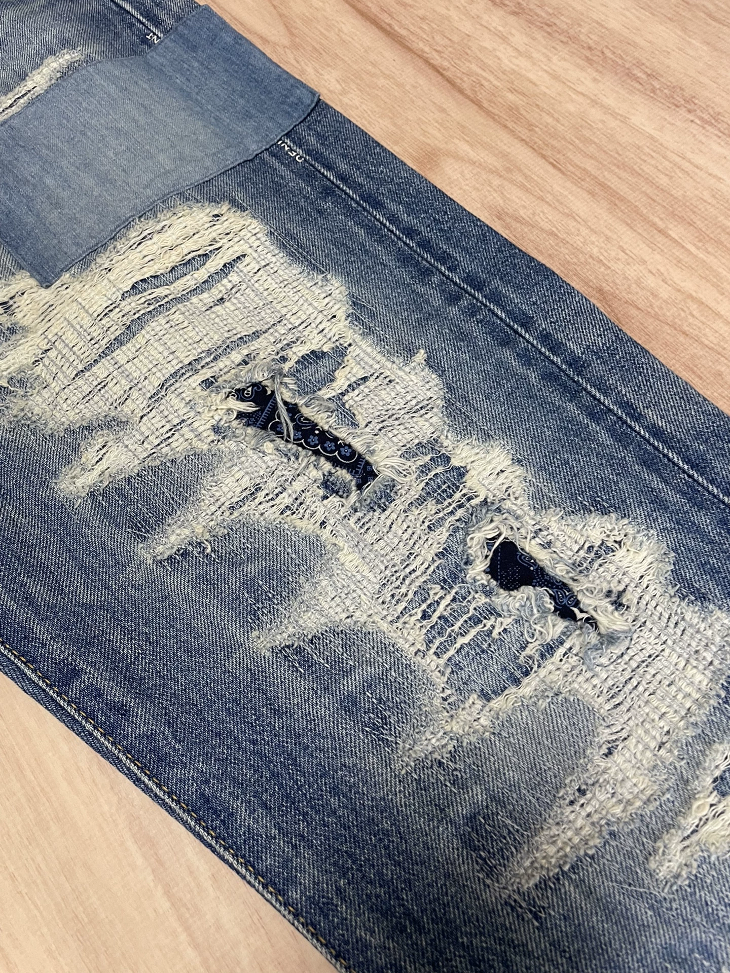 Vanquish Fragment Distressed Denim Jeans — label