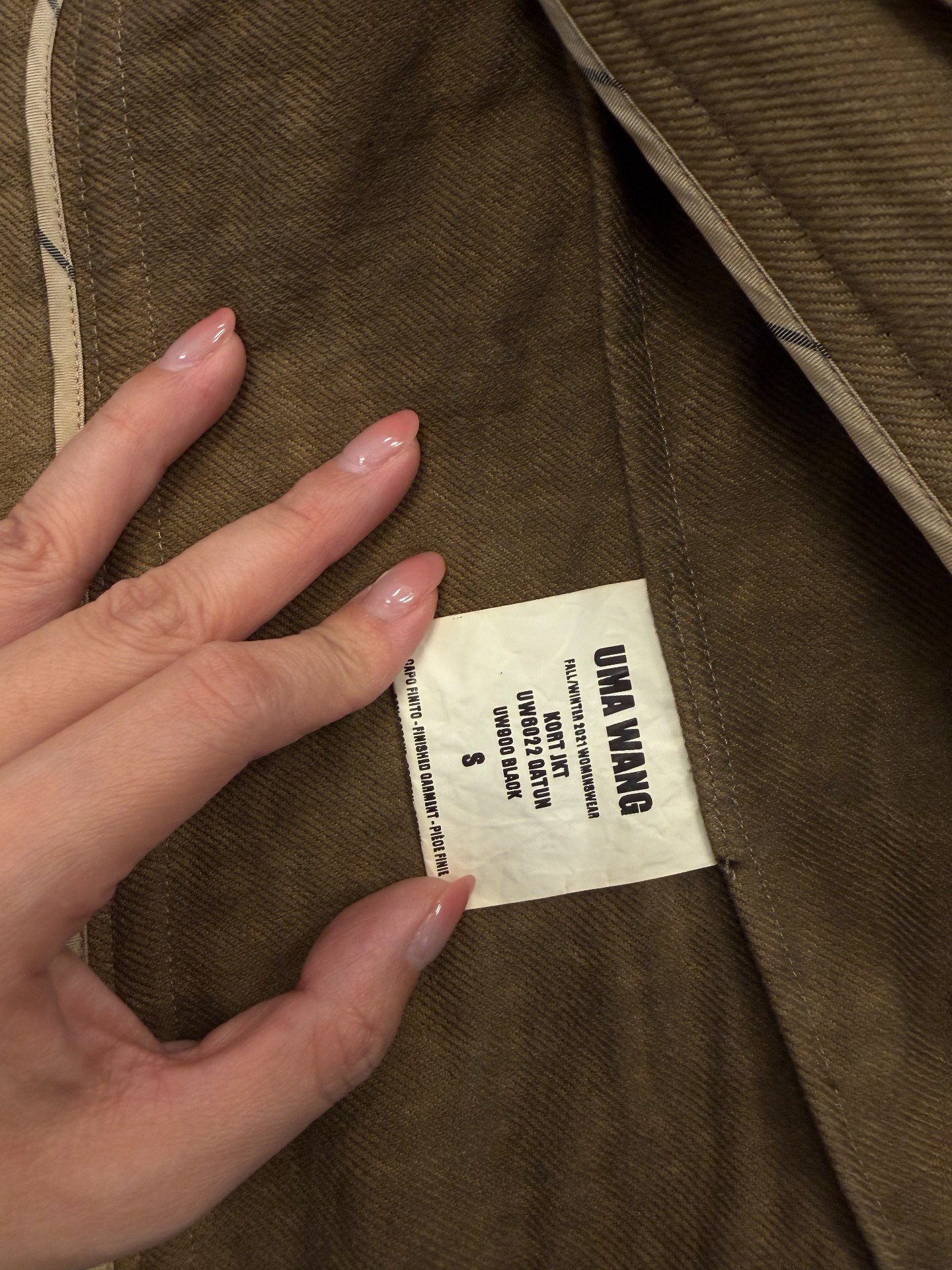 UMA WANG Black Distressed Coat — label