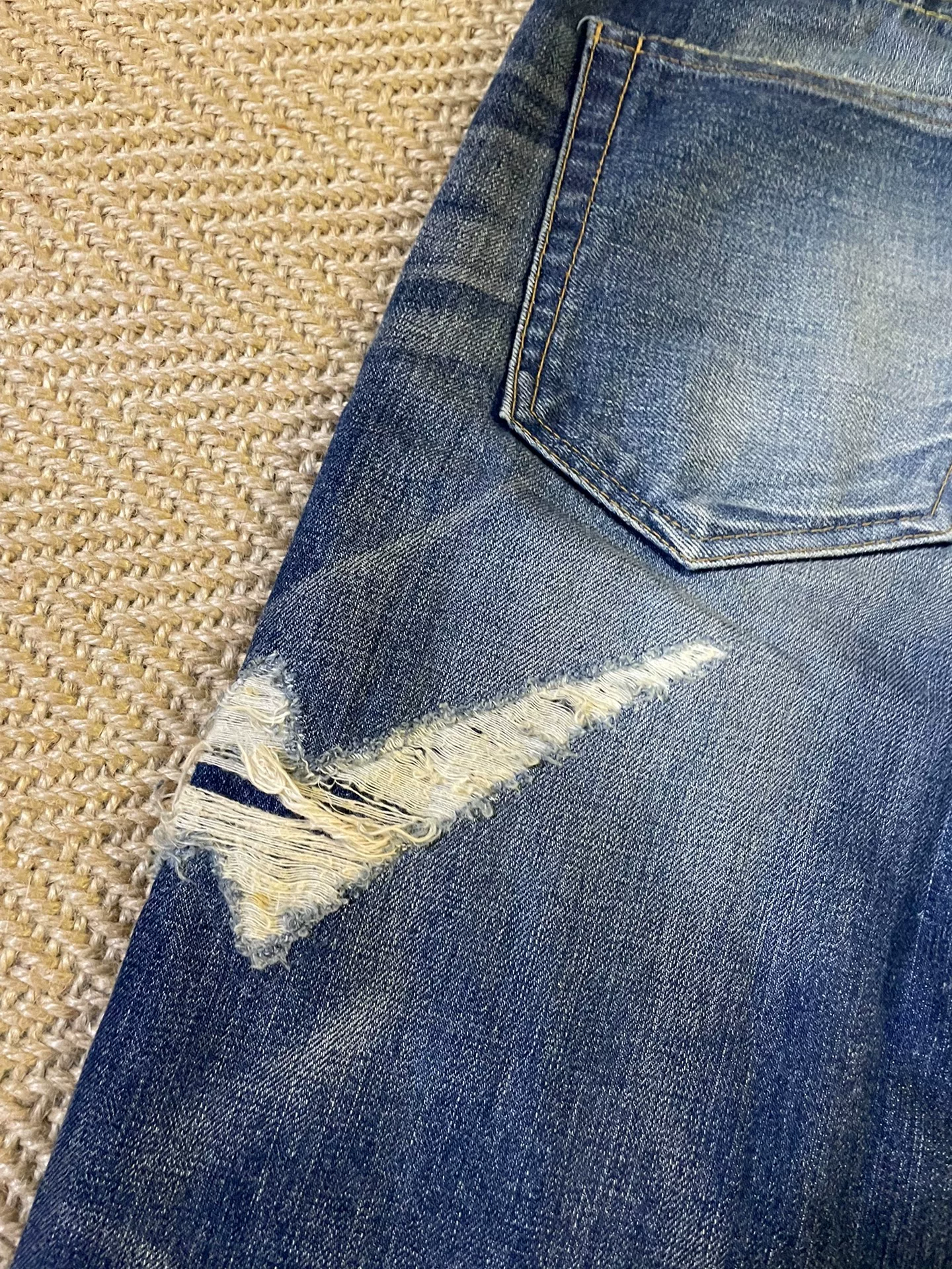 Vanquish & Fragment Distressed Lightning Jeans — label