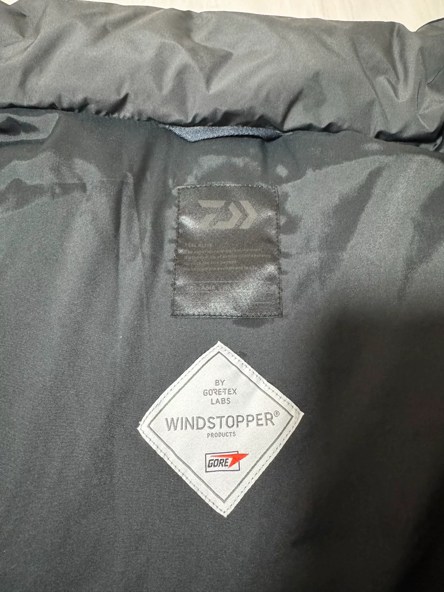 DAIWA PIER39 23AW Hooded Down Jacket — label