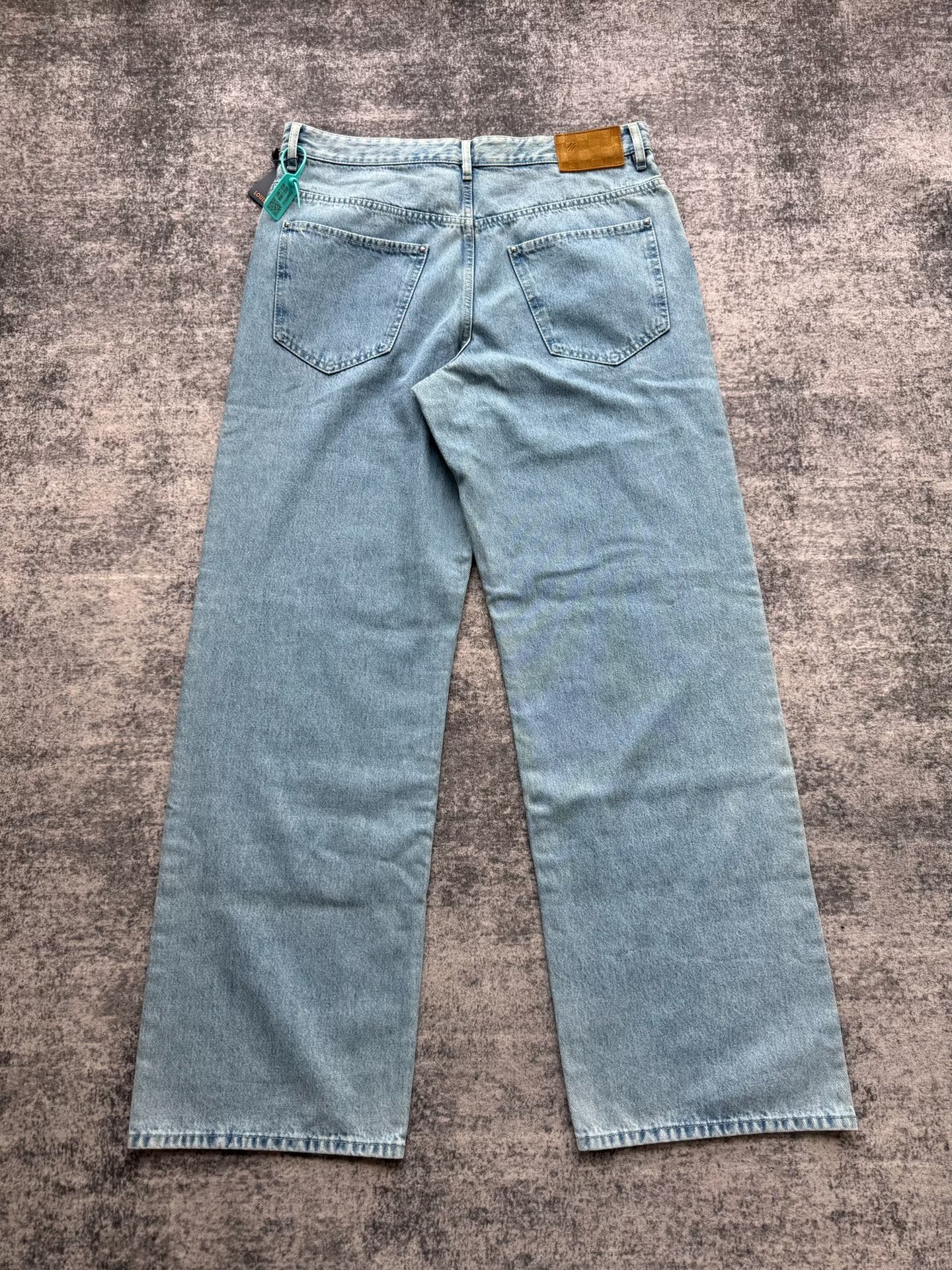 Louis Vuitton SS25 Distressed Logo Denim Pants — front