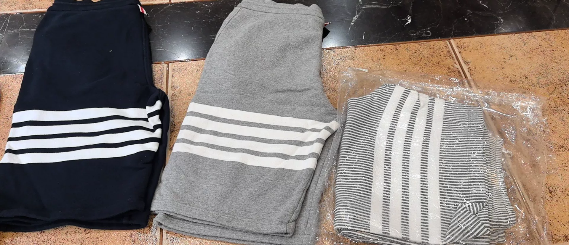 Thom Browne Gray Four-Stripe Shorts — front
