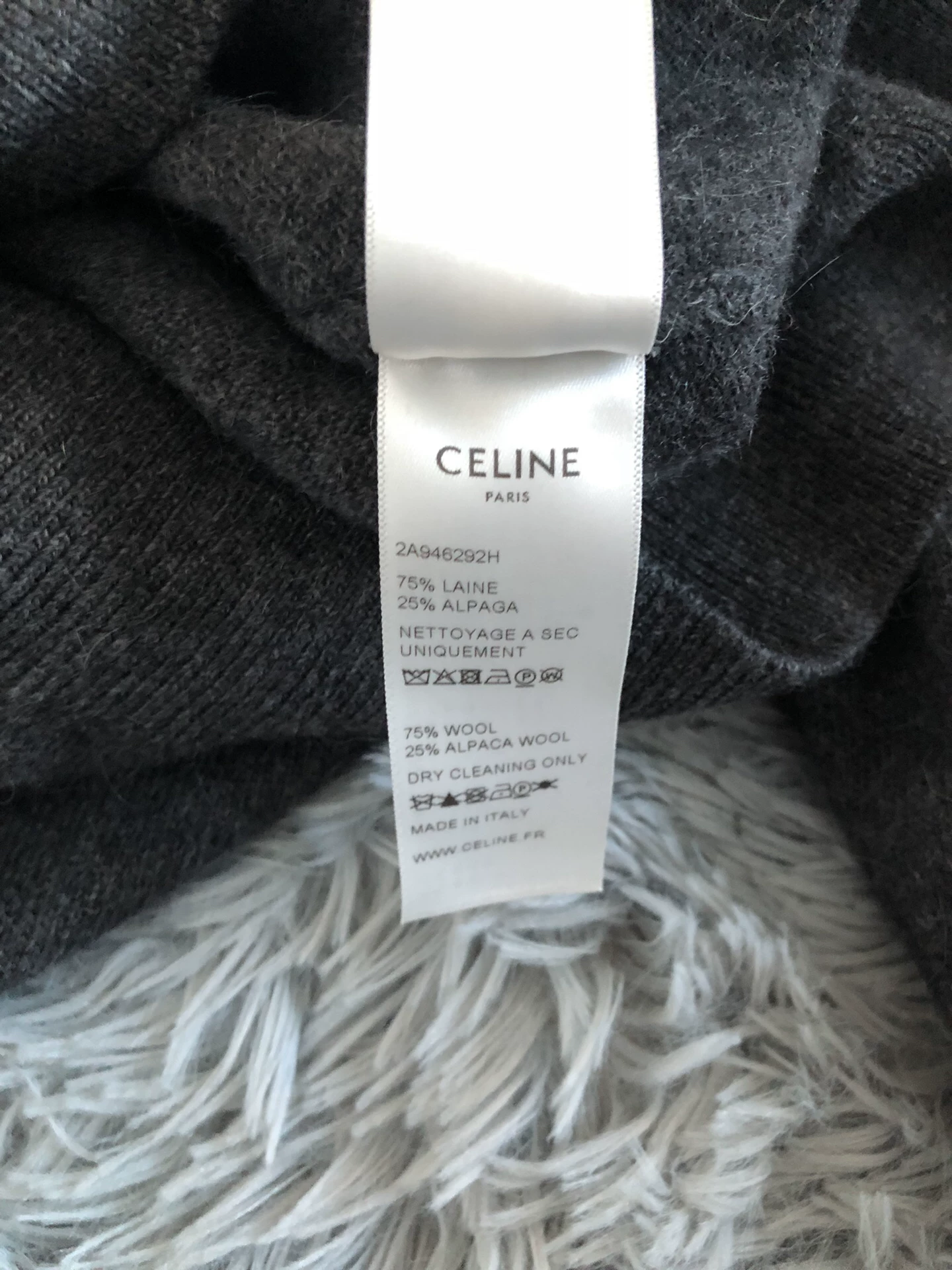 Celine Ruffled High Neck Sweater — label