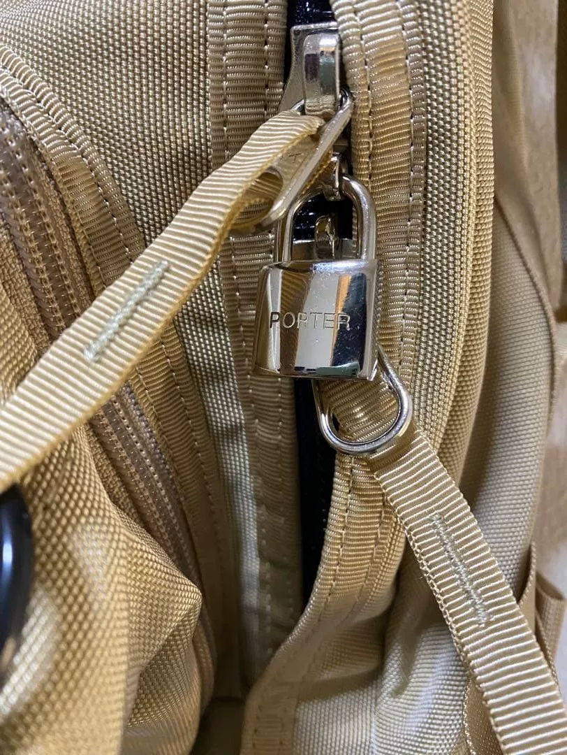 PORTER Functional Beige Canvas Backpack — label