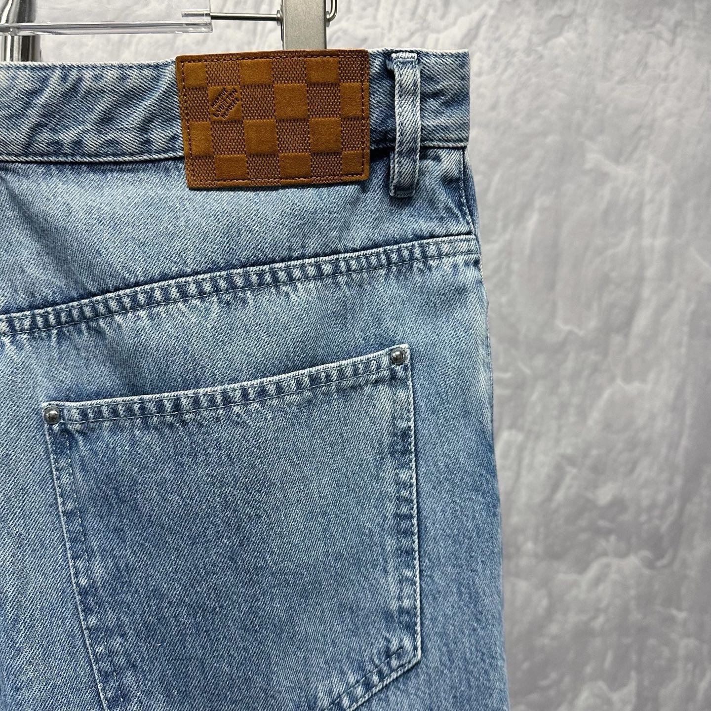 Louis Vuitton SS25 Distressed Logo Denim Pants — detail