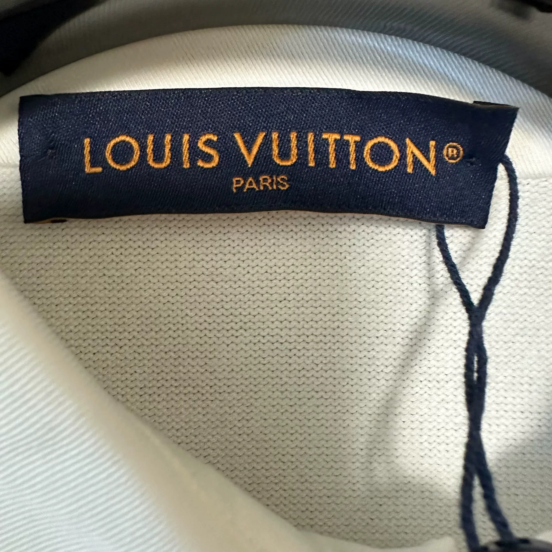 Louis Vuitton White Pearl Button Polo Shirt — detail