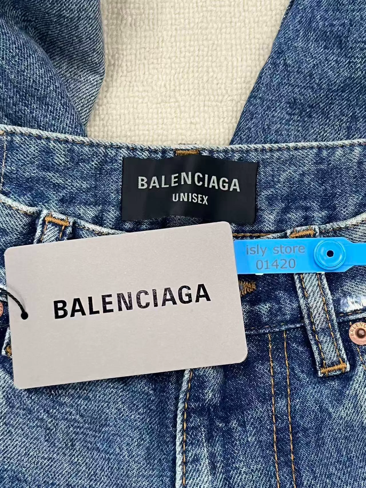 Balenciaga Baggy Distressed Denim Jeans — label