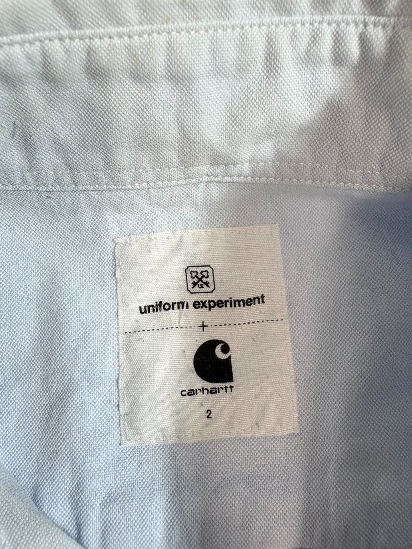 uniform experiment x Carhartt shirt — label