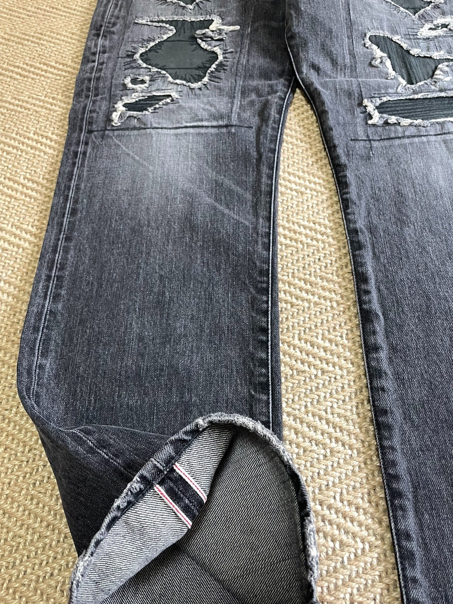 Vanquish & Fragment Distressed Washed Jeans — label