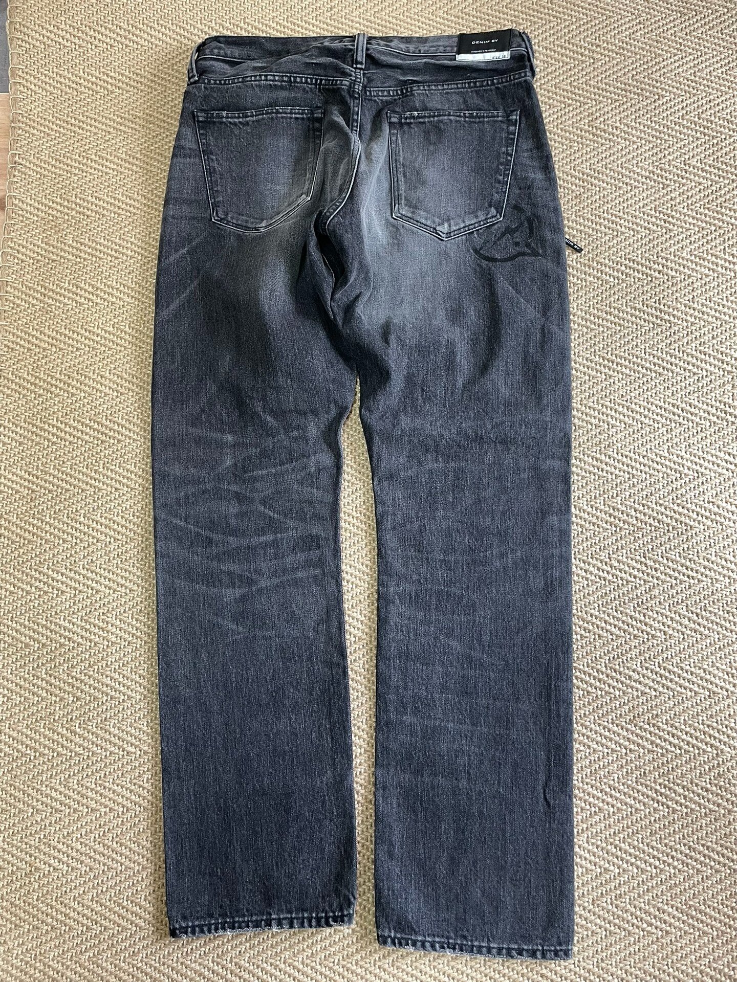 Vanquish & Fragment Distressed Washed Jeans — front