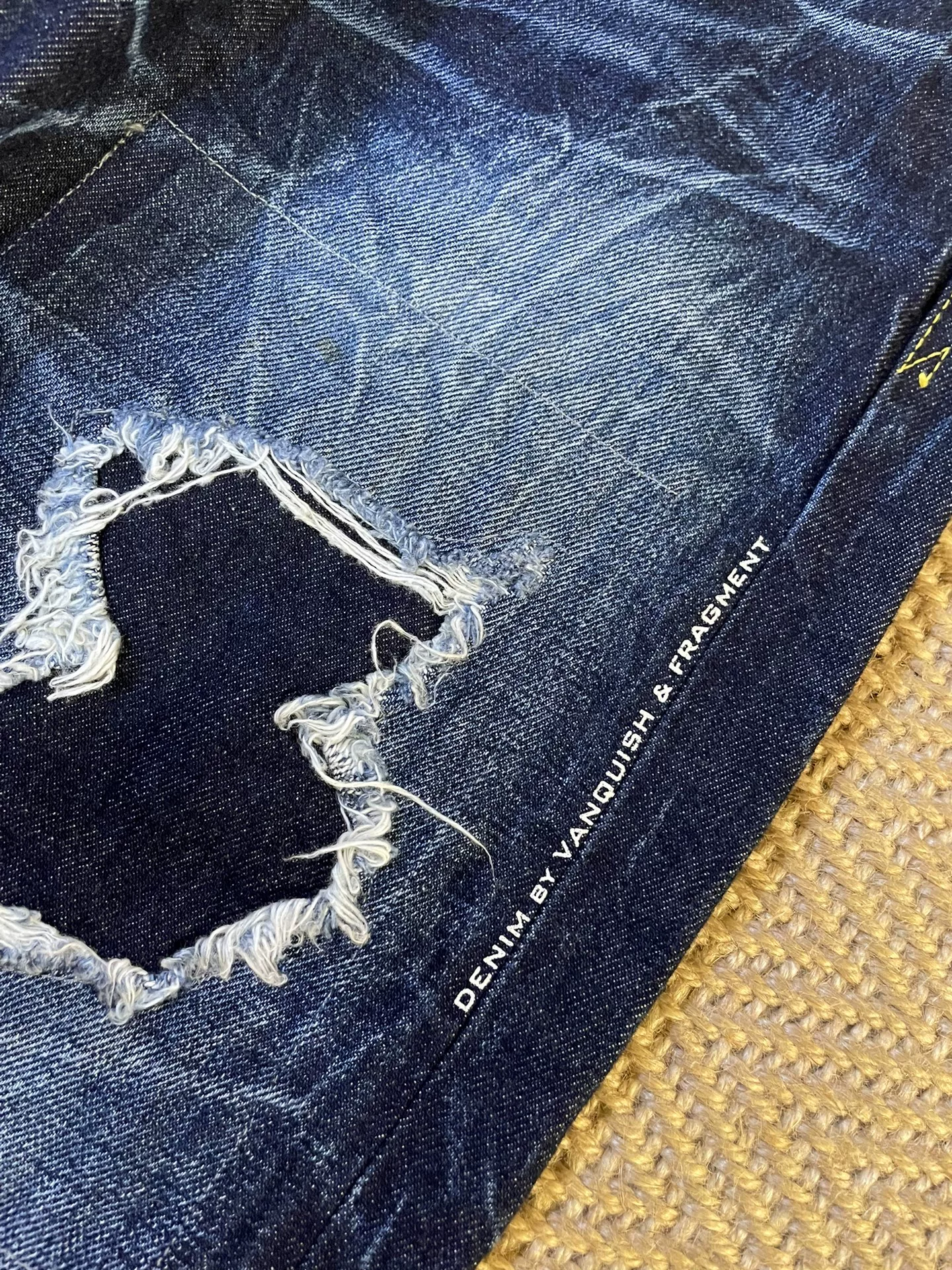 Vanquish Fragment Distressed Denim Jeans — label