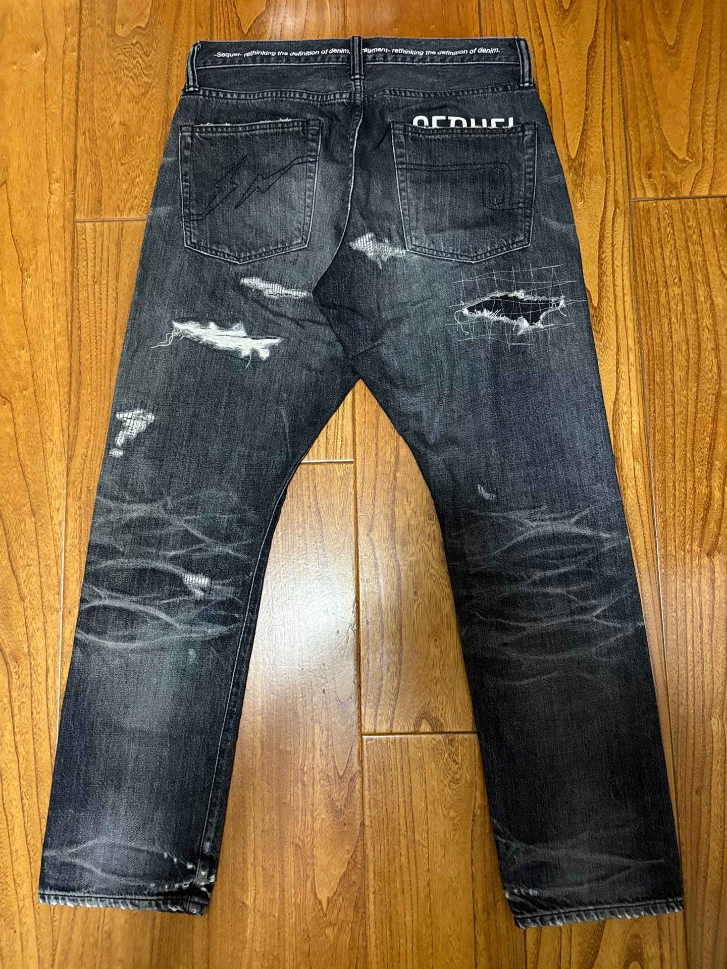 Sequel Fragment Distressed Washed Denim Pants — front