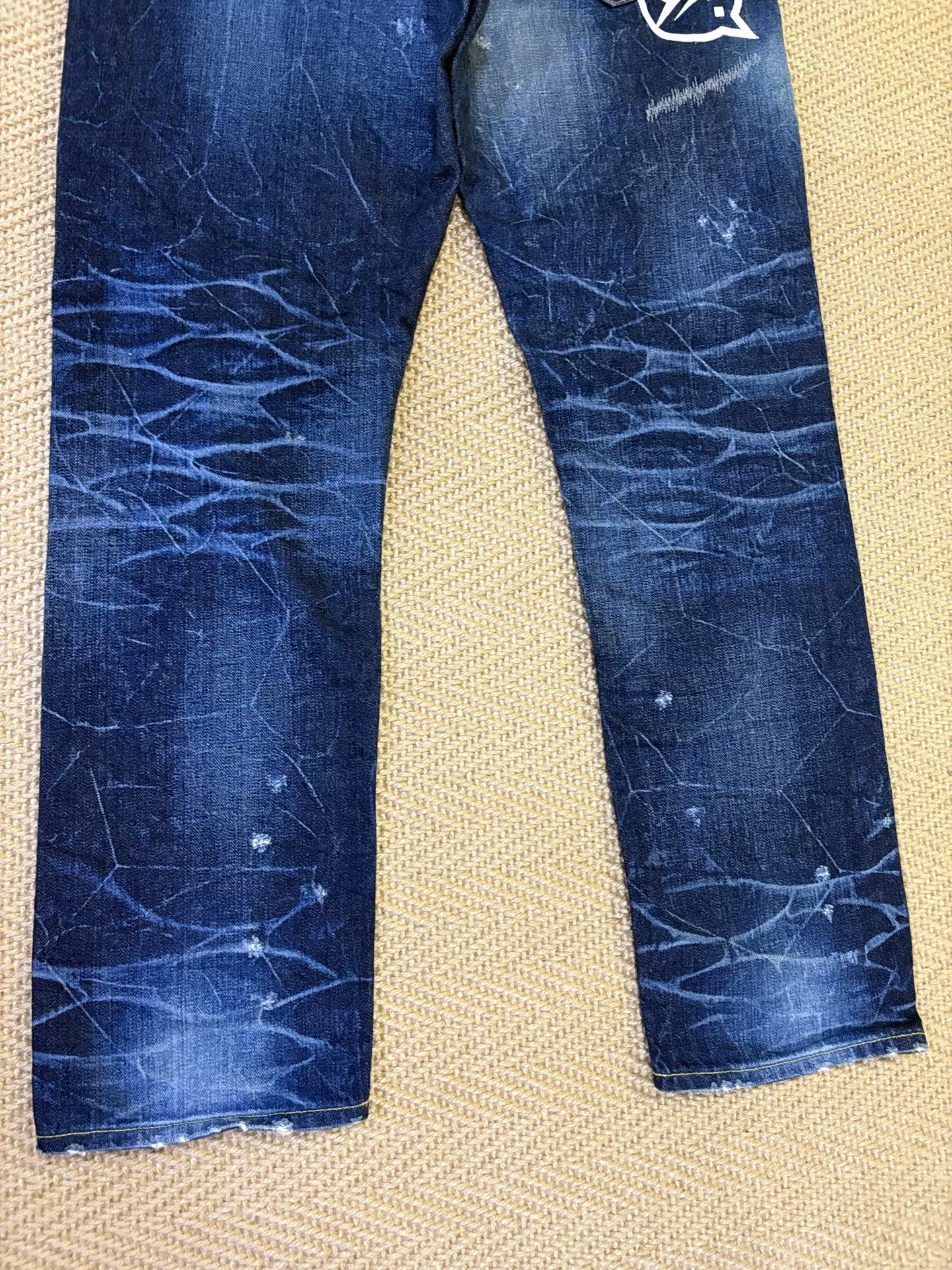 Vanquish & Fragment Distressed Denim Jeans — label