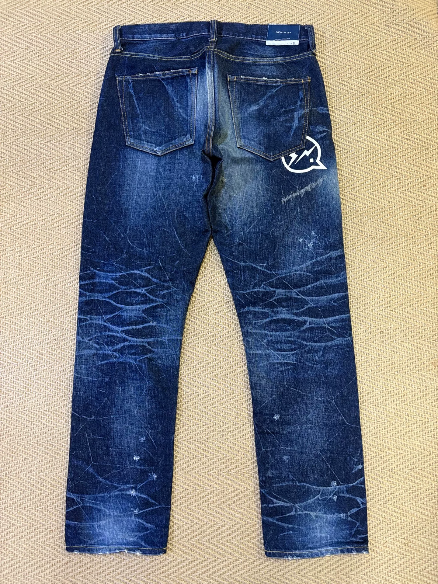 Vanquish & Fragment Distressed Denim Jeans — front