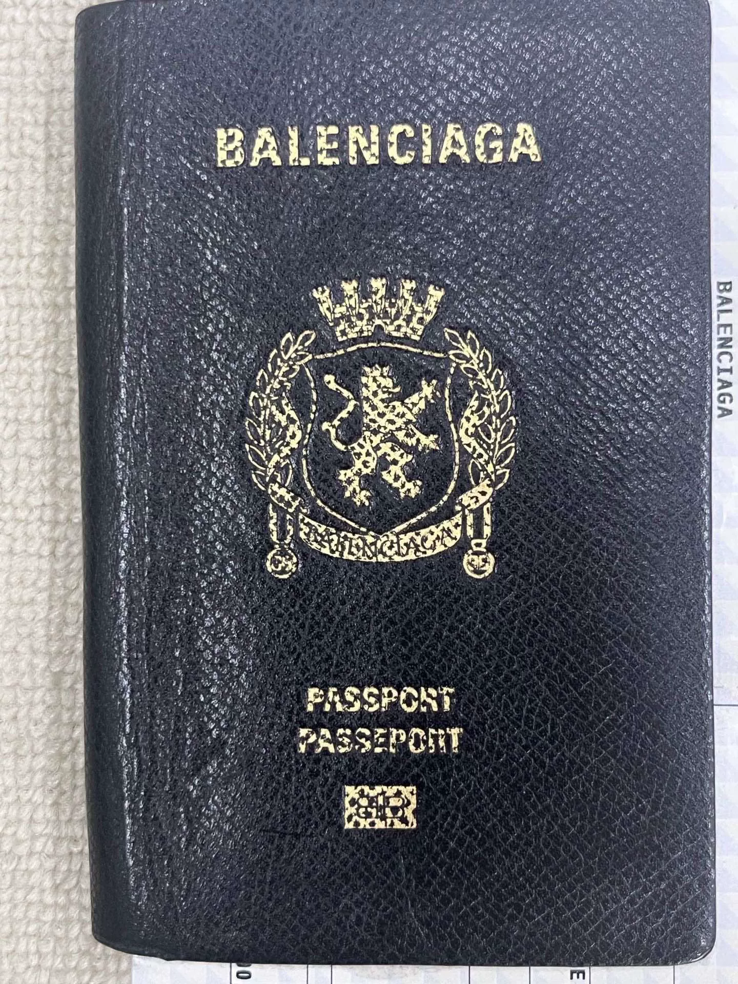 Balenciaga Passport Logo Embossed Wallet — front