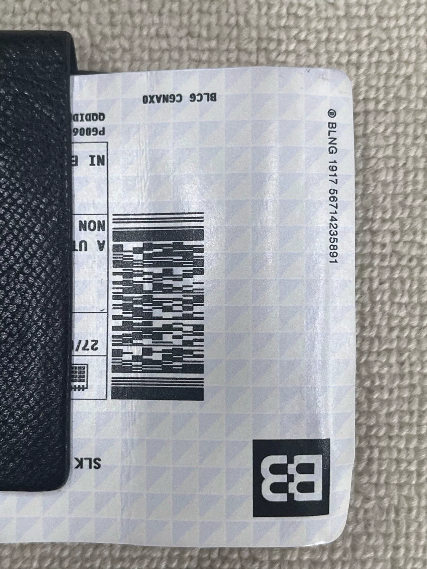 Balenciaga Passport Logo Embossed Wallet — detail