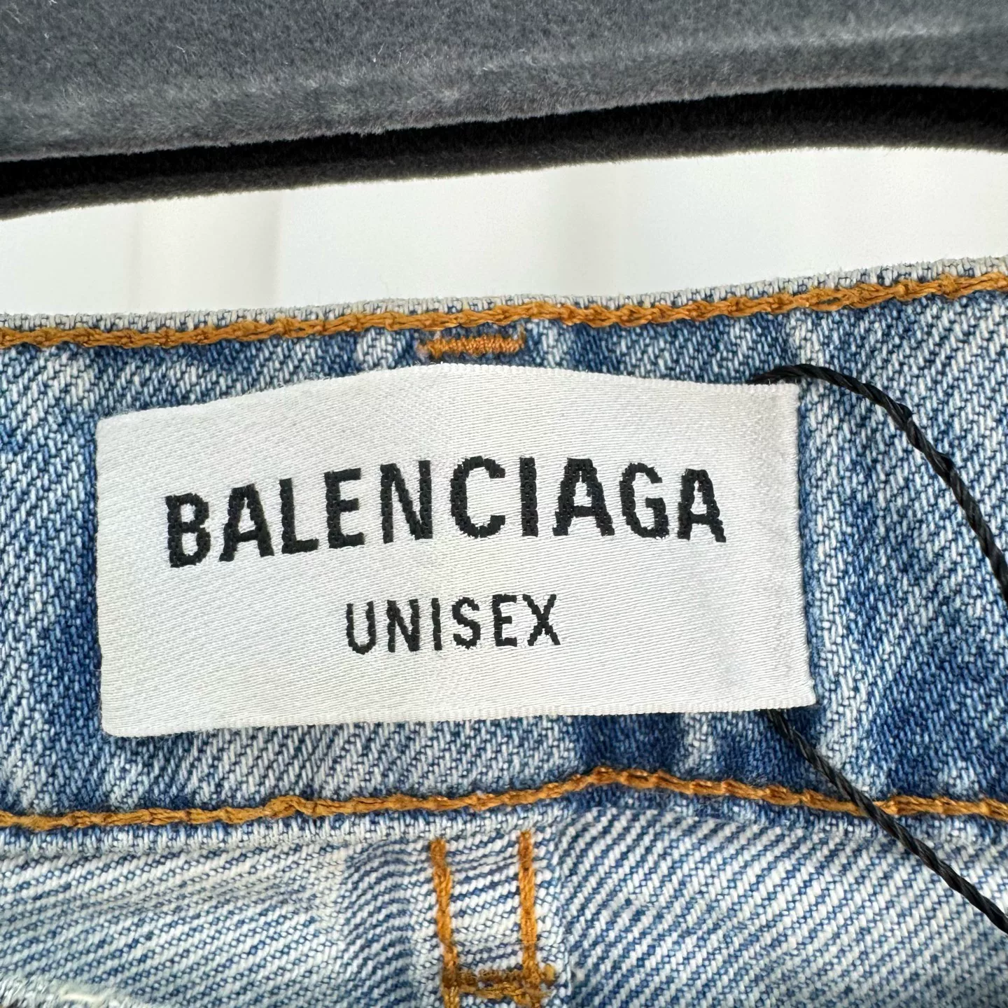 Balenciaga Washed Distressed Jeans — label