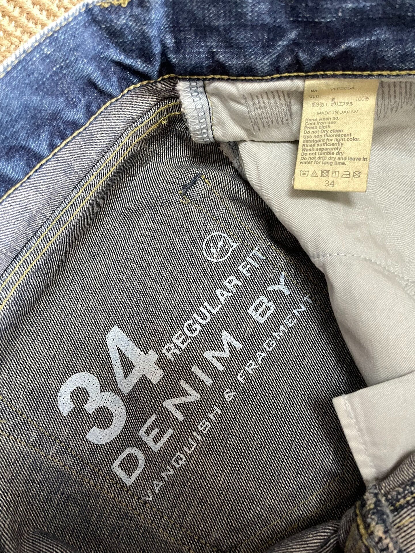 Vanquish Fragment Lightning Distressed Jeans — label