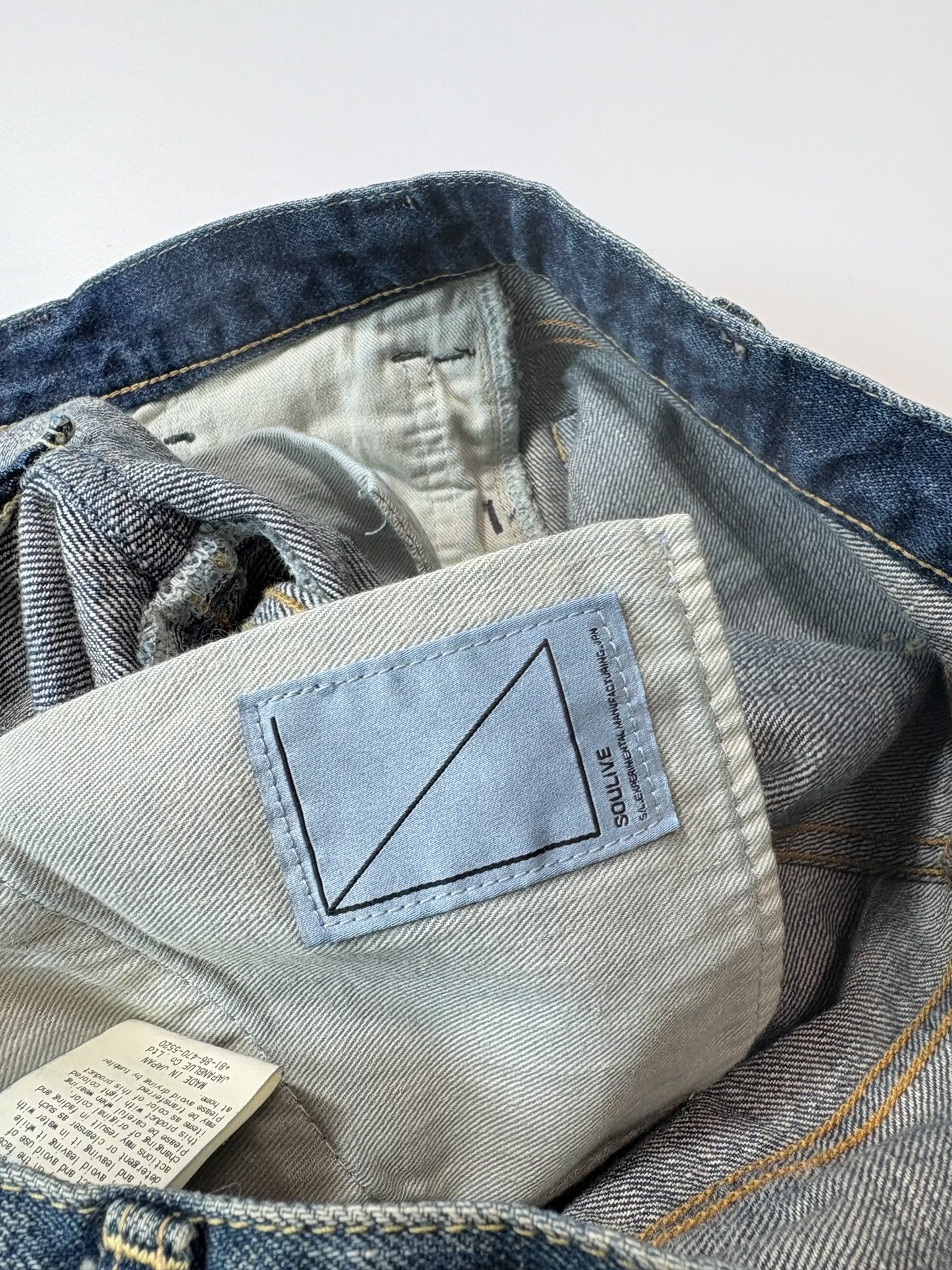 Soulive Okayama Washed Denim Jeans — label