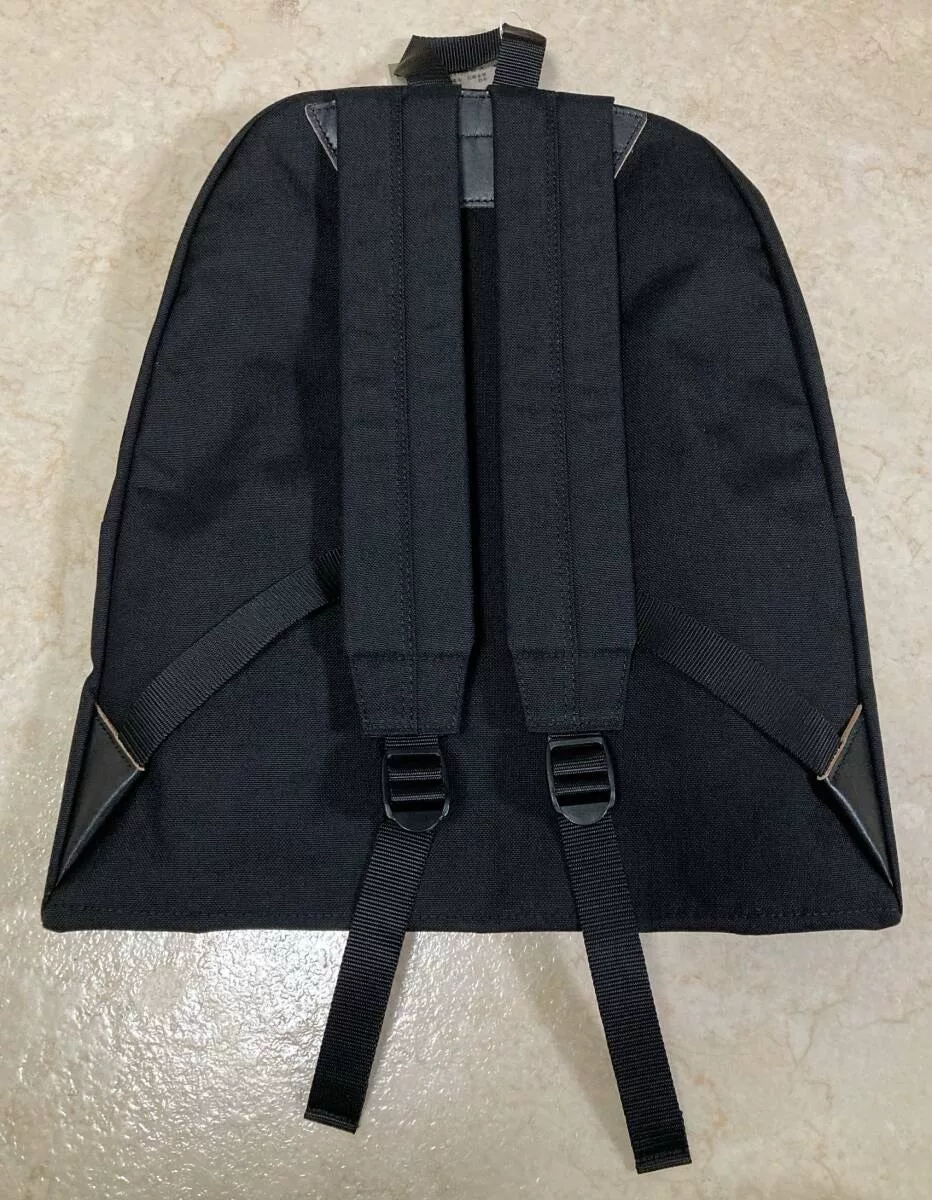 COMME des GARÇONS Homme Plus Black L Backpack — label