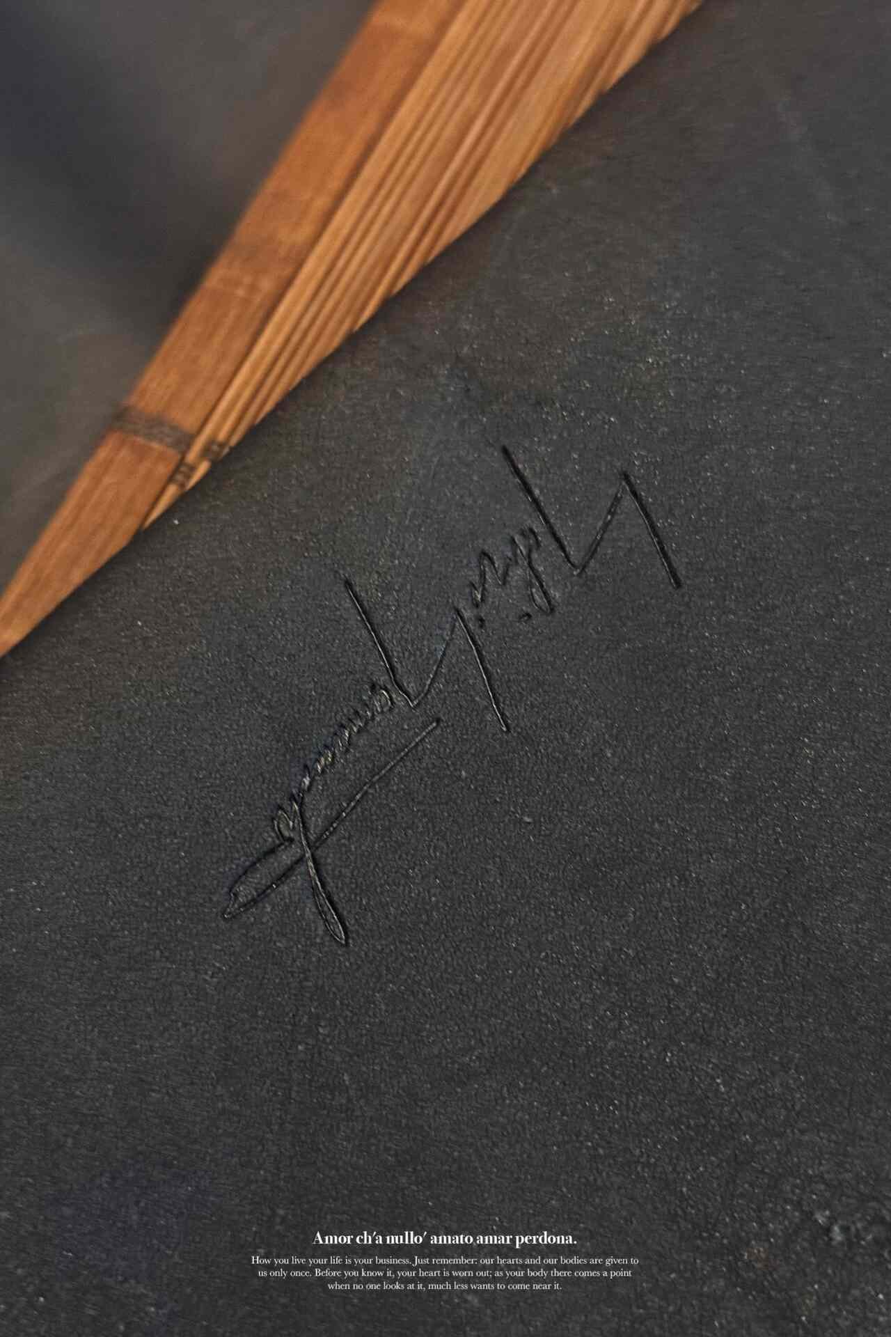 Yohji Yamamoto Distressed Black Leather Laptop Bag — label