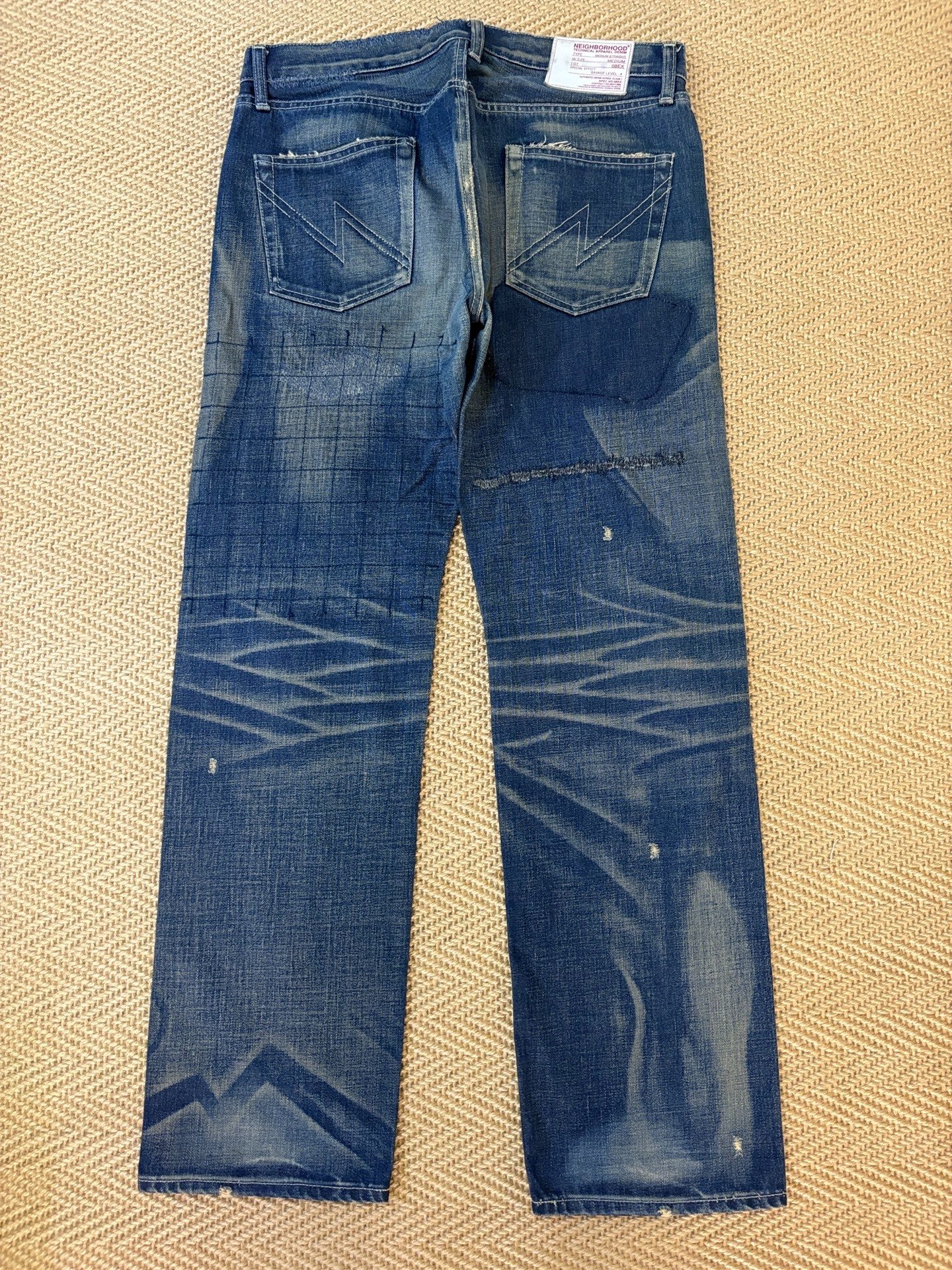 NEIGHBORHOOD 08EX Washed Distressed Jeans — front