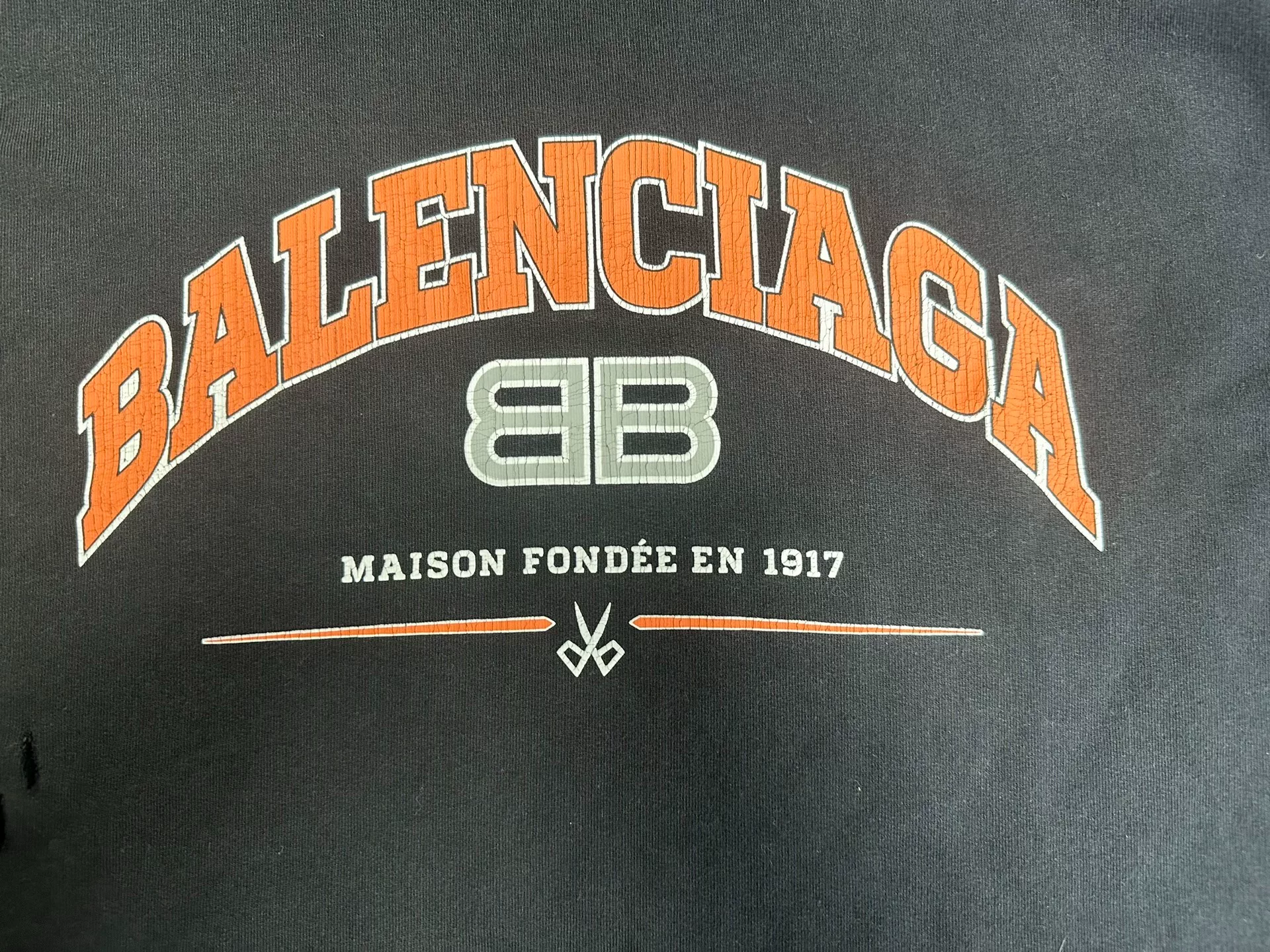 Balenciaga Black Orange Lettering Hoodie — detail