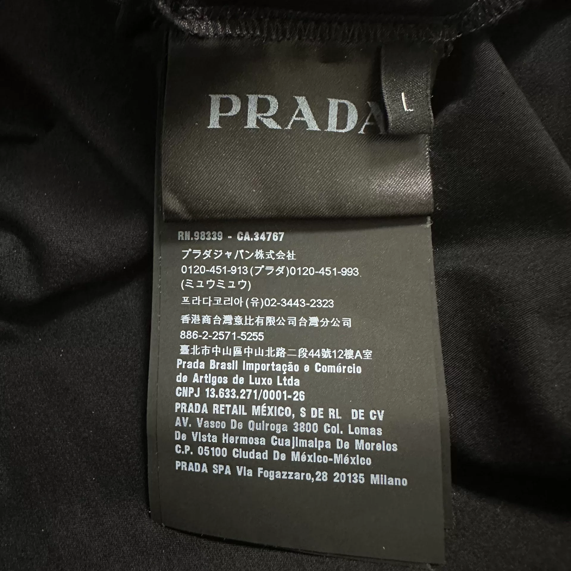 Prada Triangle Logo Chest Pocket Polo — label
