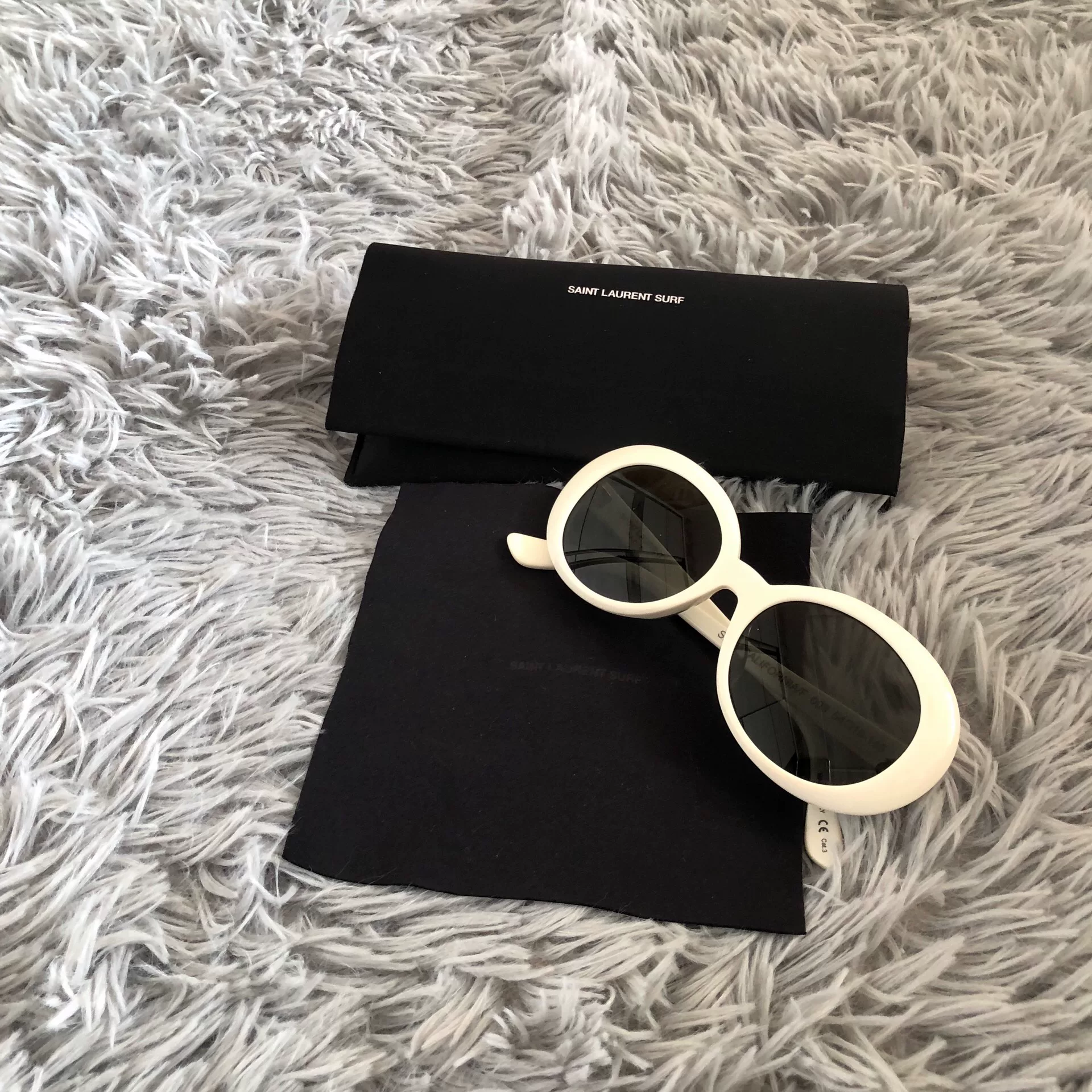 Saint Laurent Ivory Round-Frame Sunglasses — label