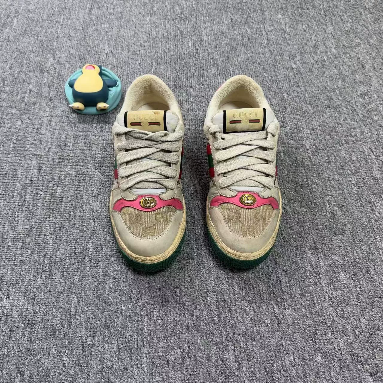 Gucci Cream Dirty Sneakers with GG — front