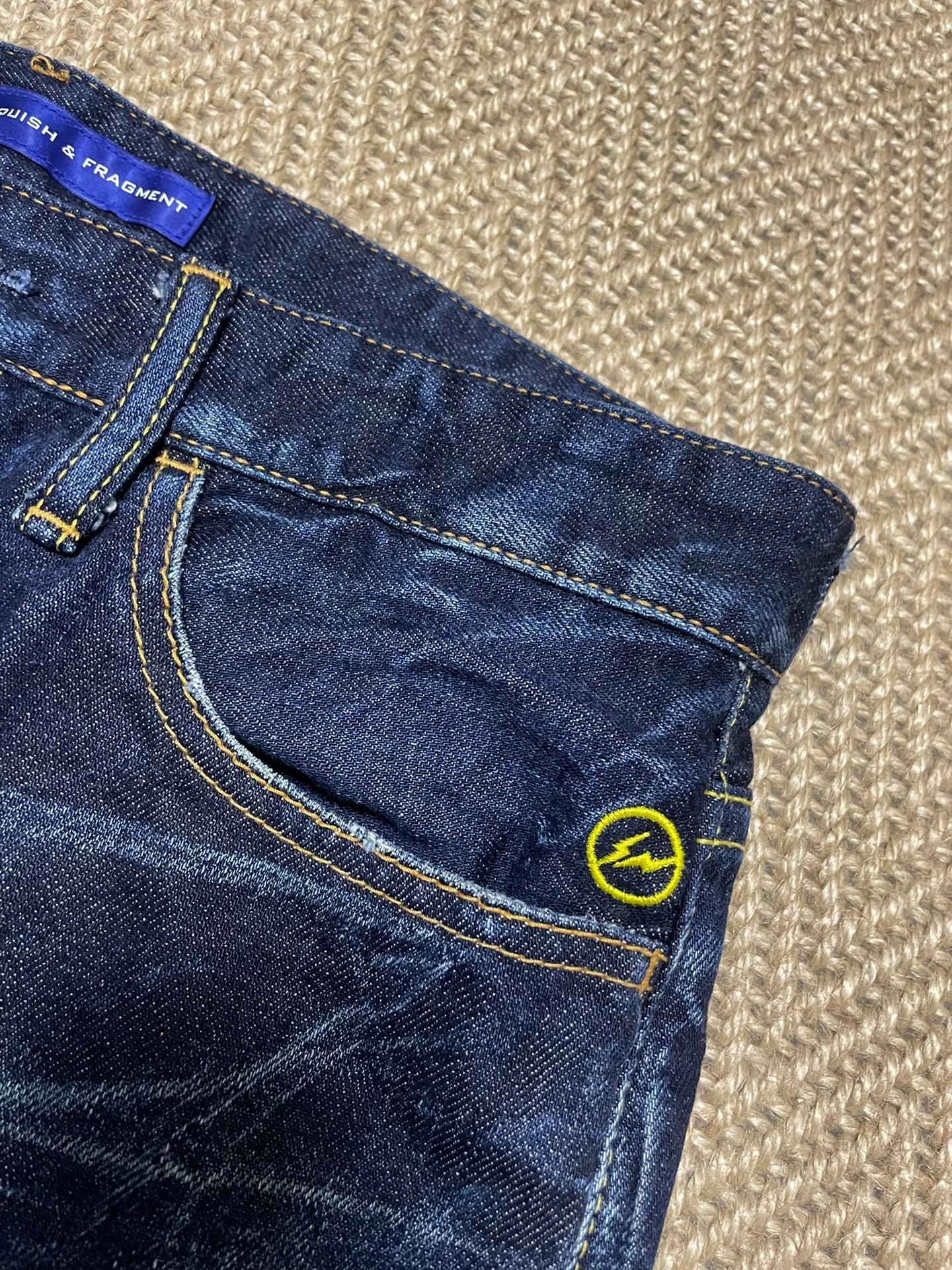 Vanquish & Fragment Cropped Denim Jeans — label