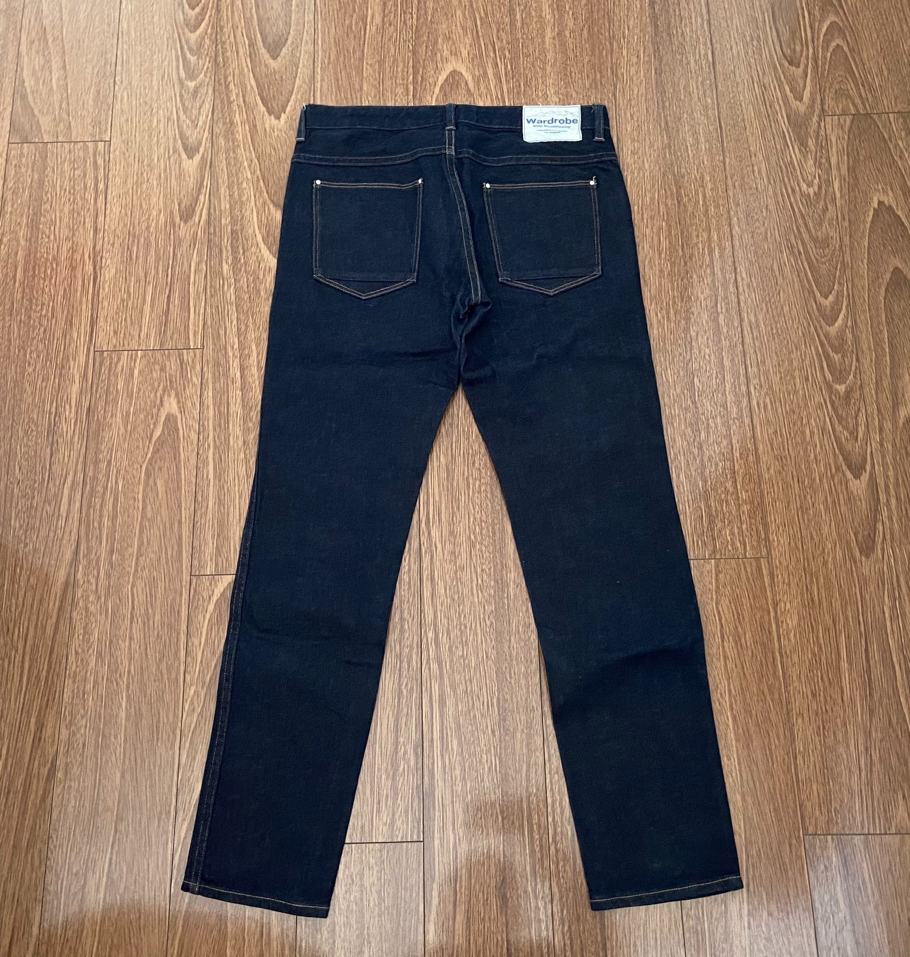 White Mountaineering Raw Denim Jeans — front