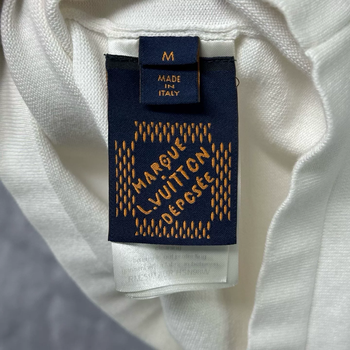Louis Vuitton SS25 Embossed Patch Knit Top — label