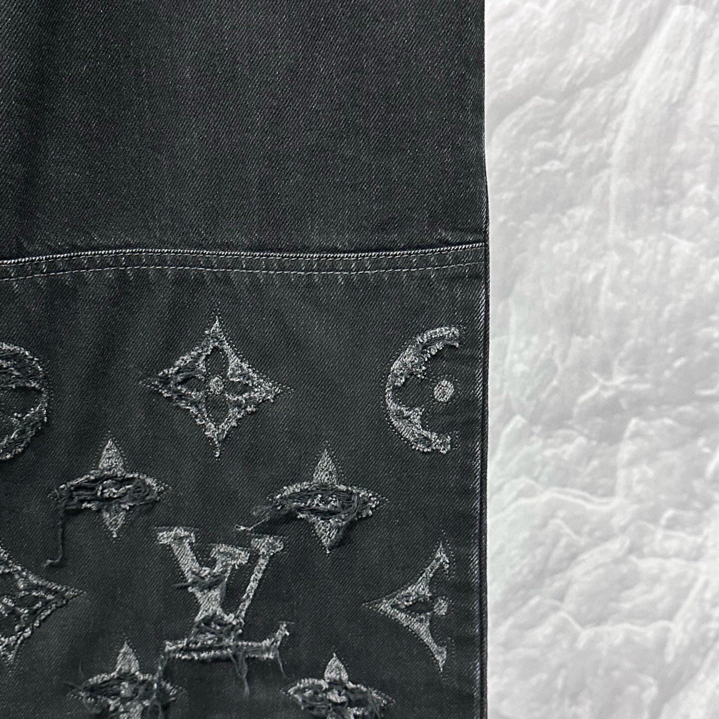 Louis Vuitton SS26 Distressed Logo Denim Pants — detail