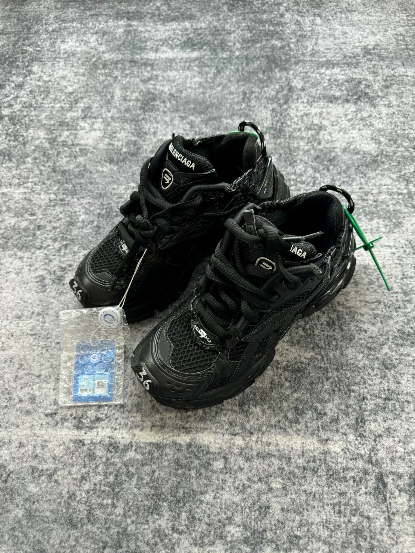 Balenciaga Black Distressed Runner Sneakers — front