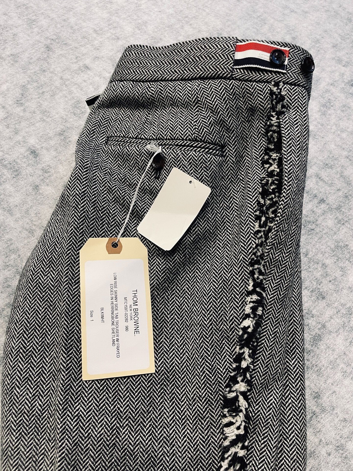 Thom Browne Low Rise Herringbone Wool Trousers — detail