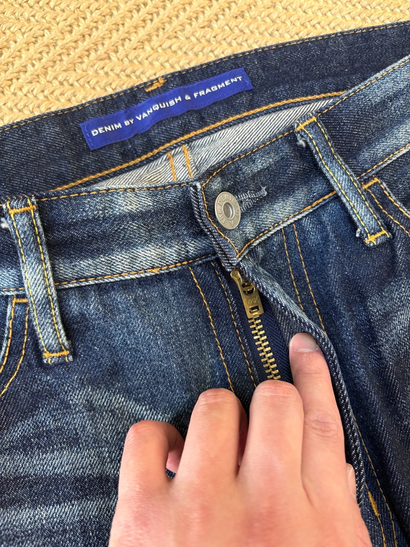 Denim by Vanquish & Fragment Washed Cropped Jeans — label