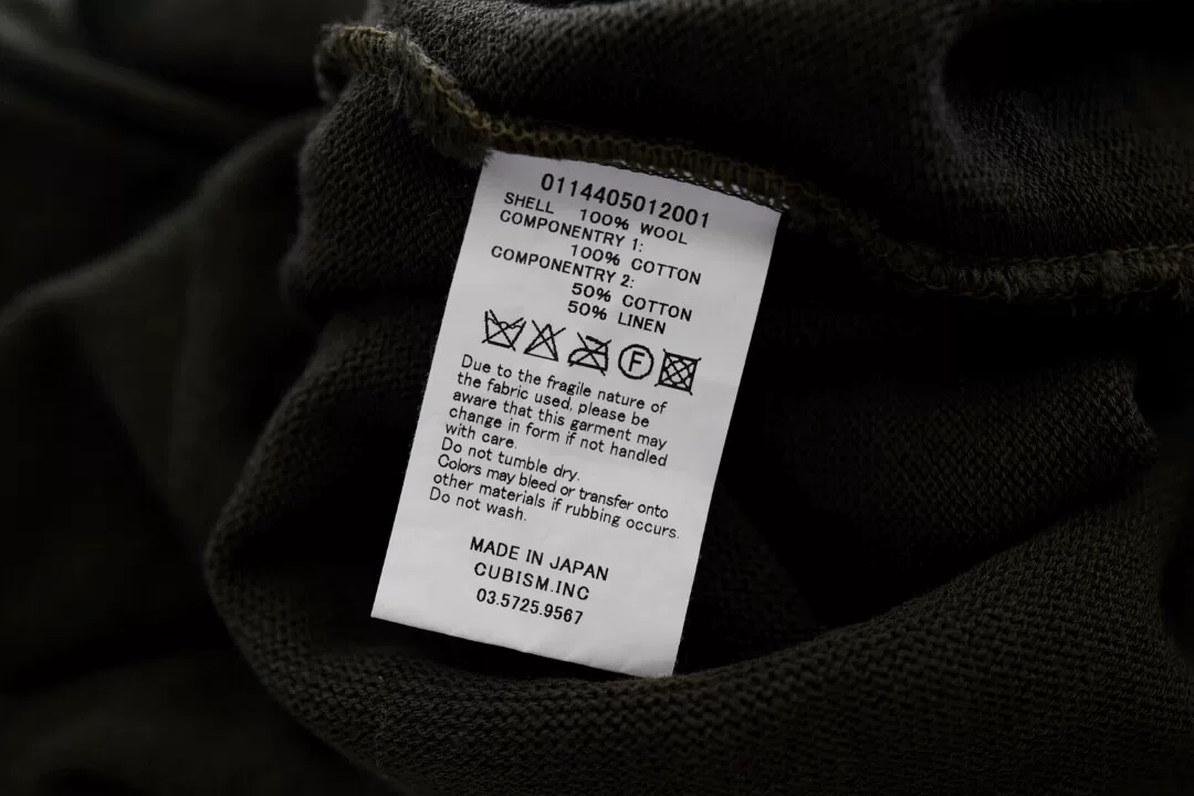 visvim Vintage Cloth Wool Crewneck Sweater — label