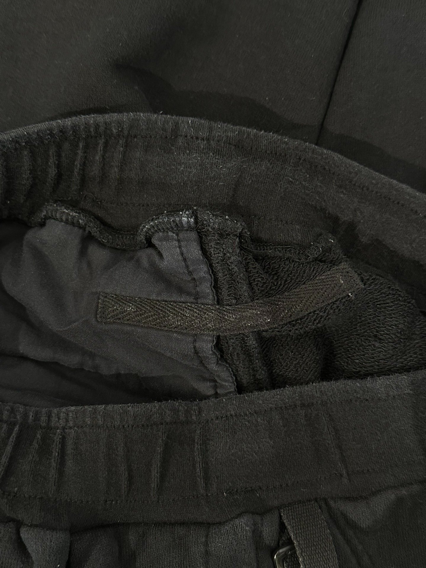 Julius_7 Black Jogger Sweatpants — label