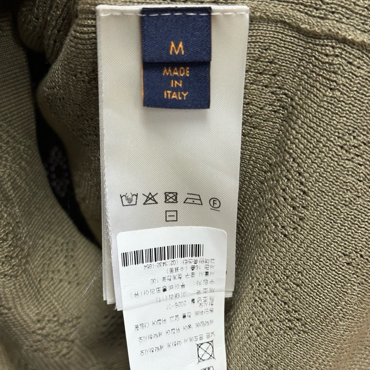 Louis Vuitton SS26 Openwork Knit Polo — label