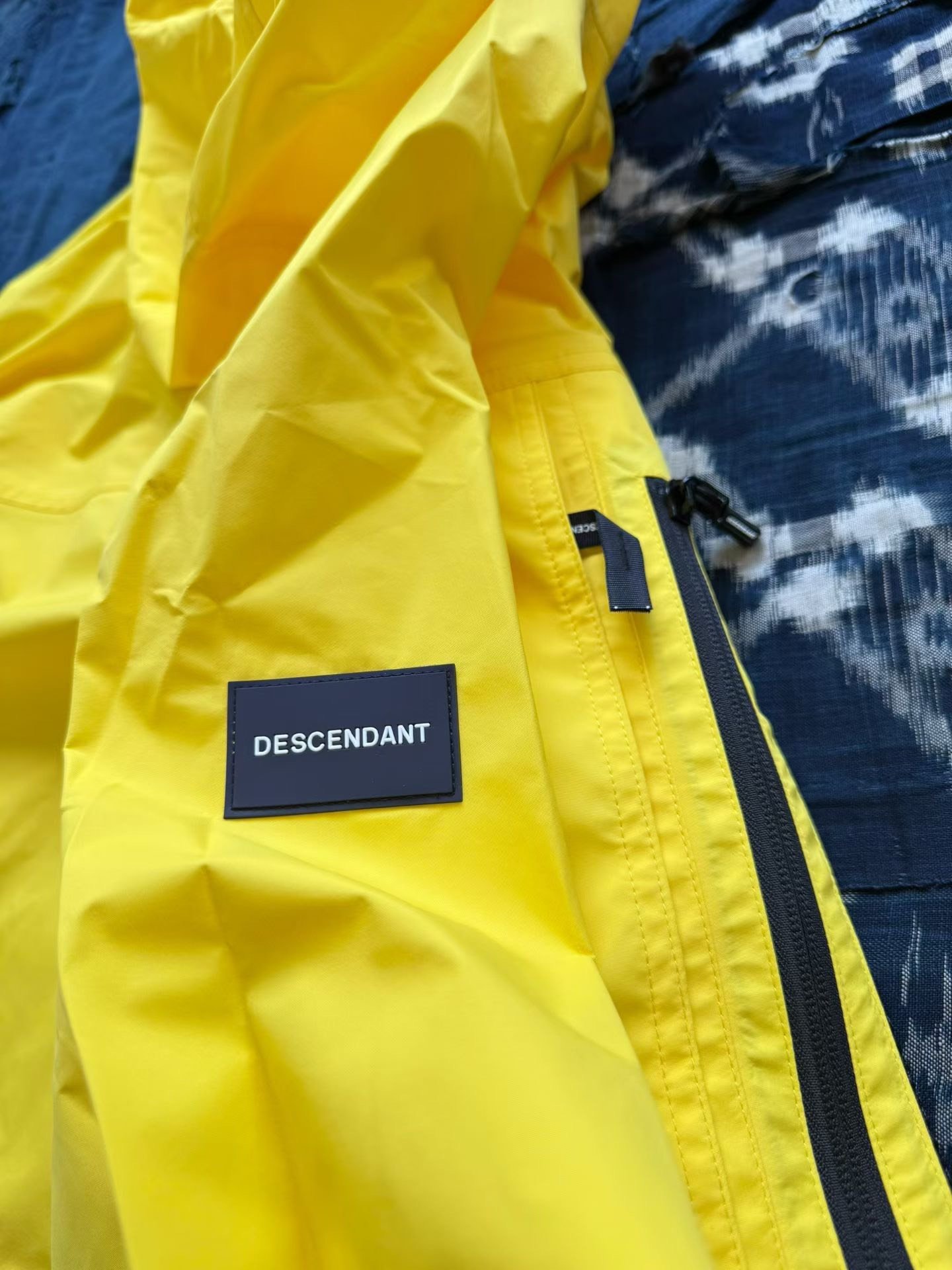 DESCENDANT DCDT 19SS AVALANCHE 3 LAYER JACKET — label