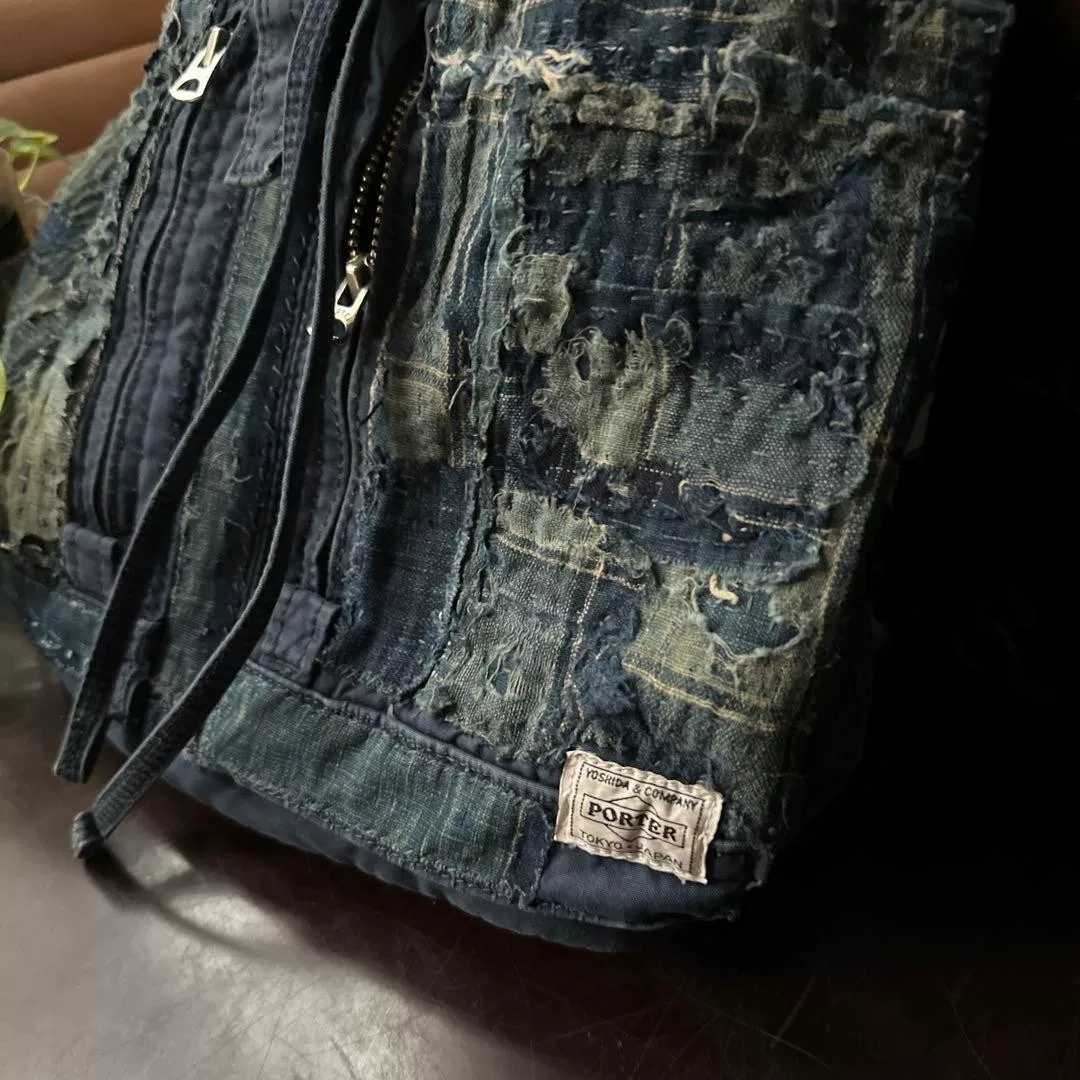 PORTER Denim Patchwork Hand-Reworked Backpack — label