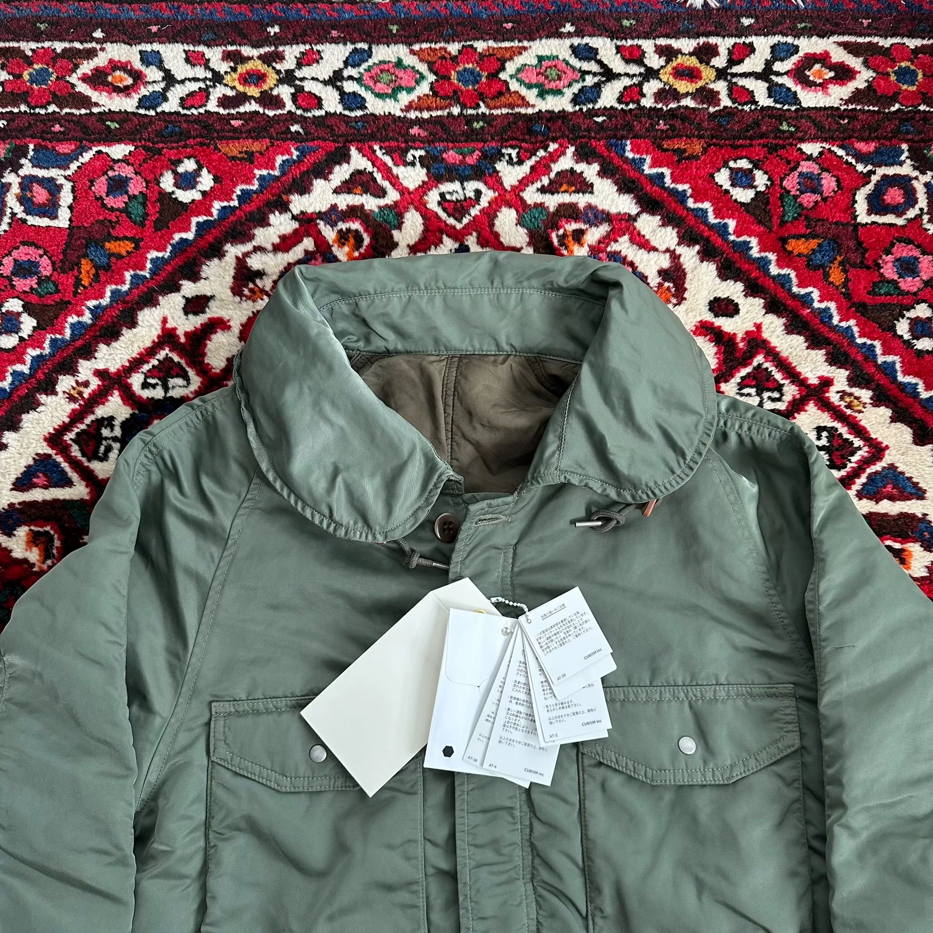 VISVIM 18AW P.F.D. JKT Mud-Dyed M65 — label