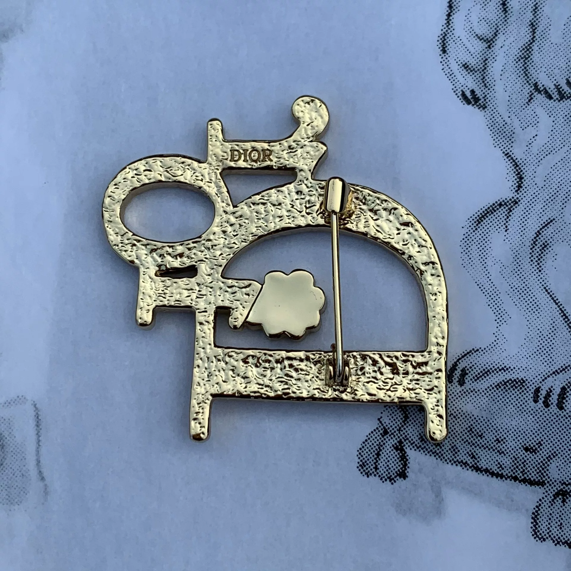 Dior Gold Letter Flower Brooch — label