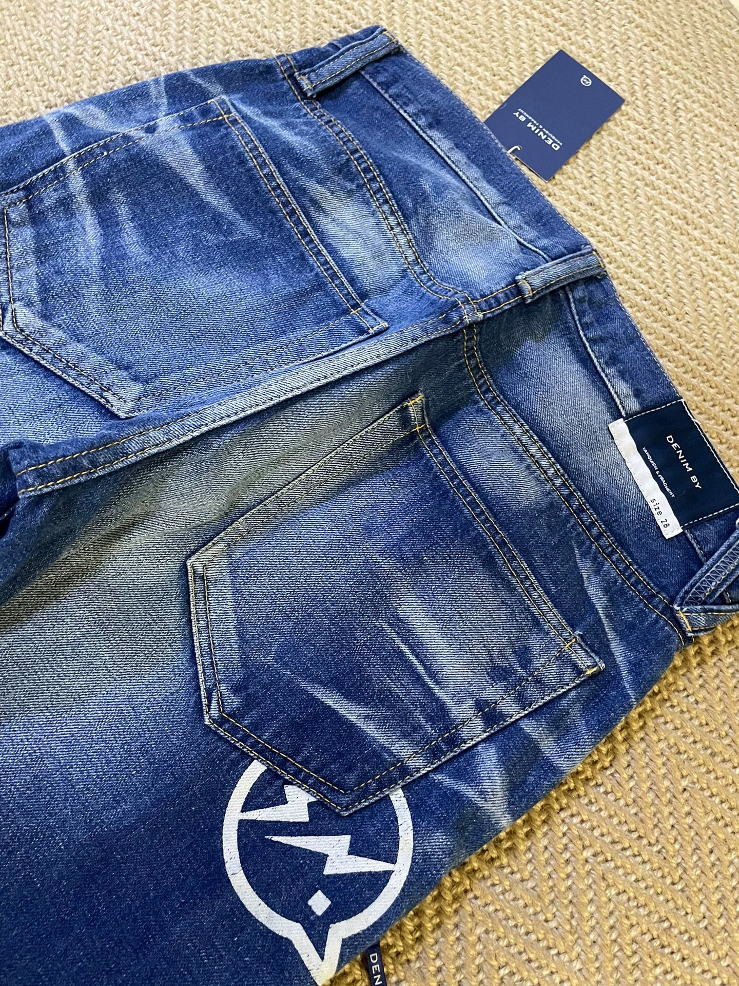 Vanquish & Fragment Cropped Denim Jeans — label
