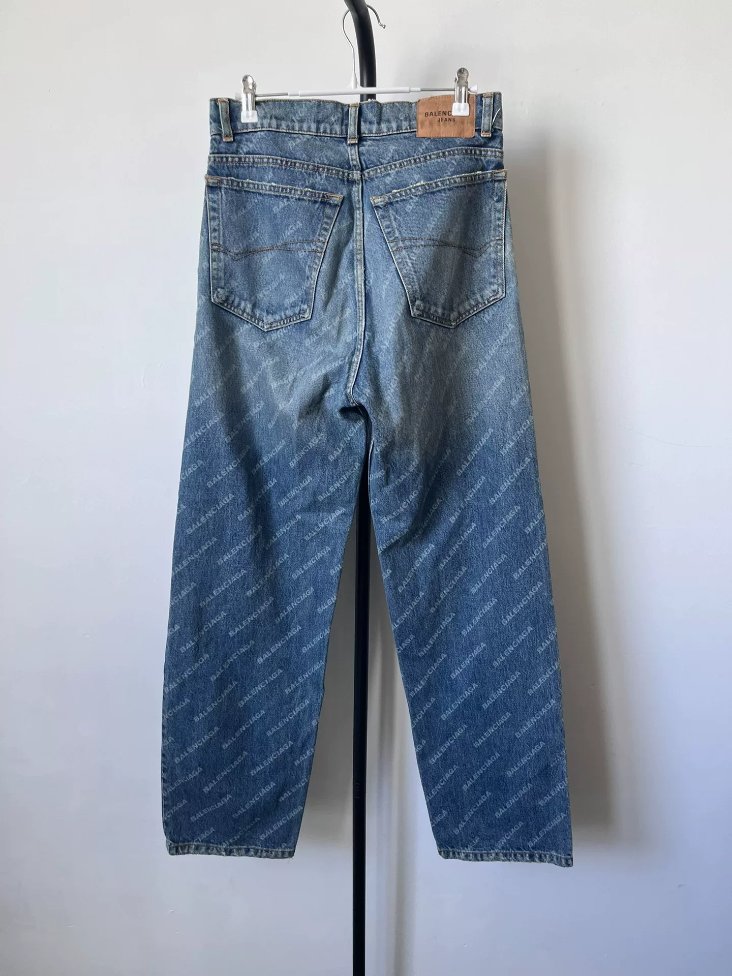 Balenciaga All-Over Logo Denim Jeans — front