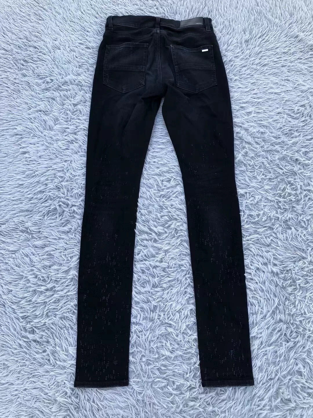 Amiri Black Distressed Straight Jeans — label