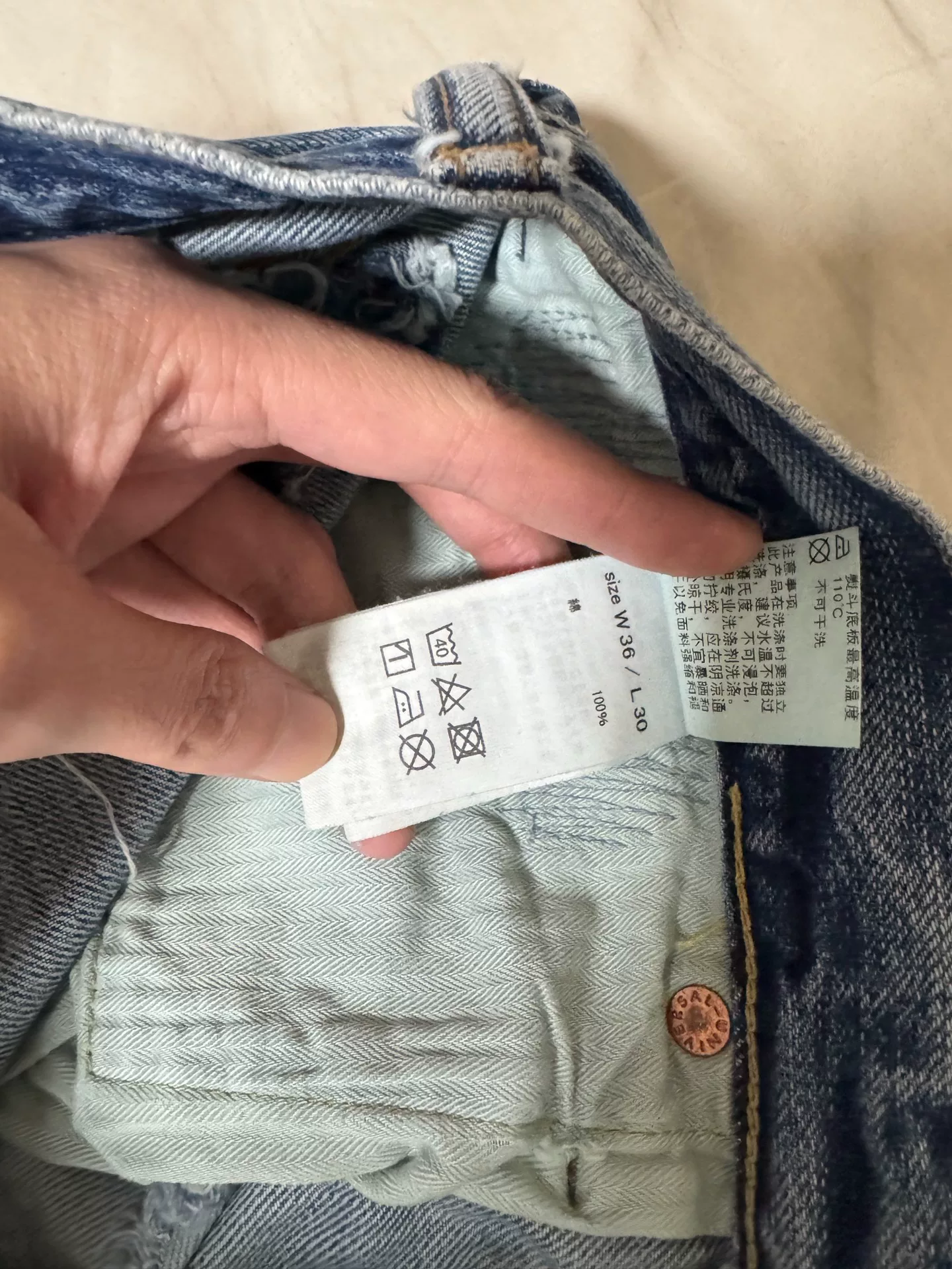 FDMTL 23AW Red Thread Distressed Jeans — label